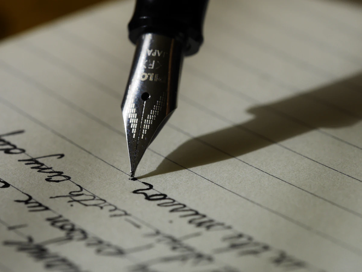 Researcher writing a manuscript by hand